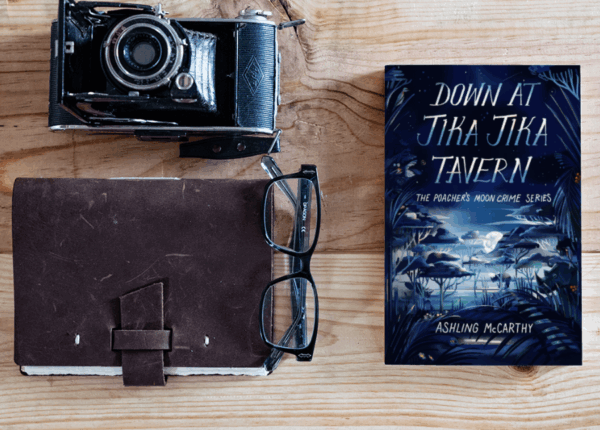 Product shot of Down at Jika Jika Tavern, the first book in The Poacher's Moon Crime Series.